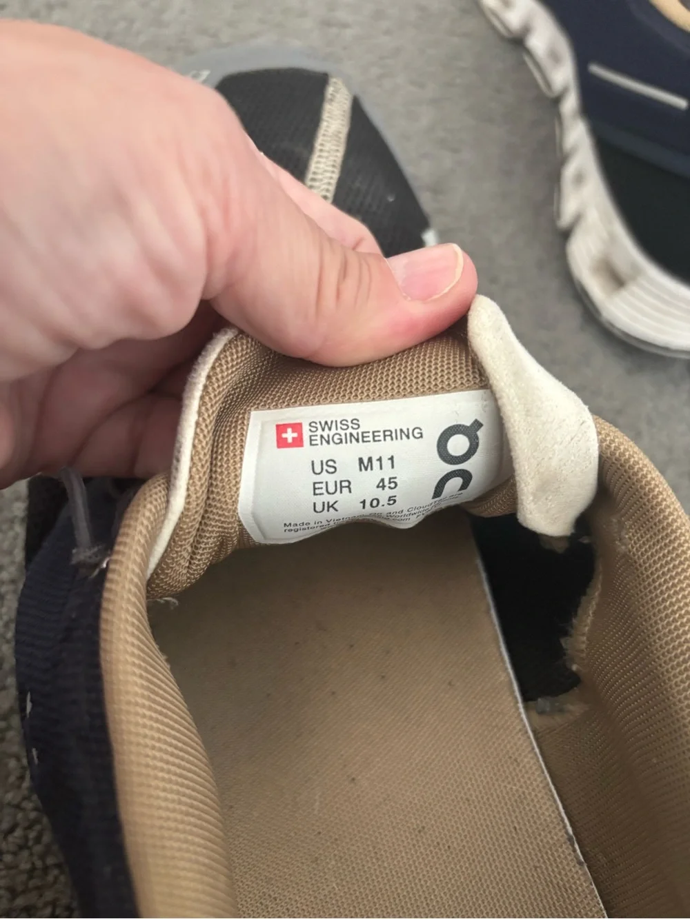 On Running Men's Athletic Shoes in Black and Cream with White Soles